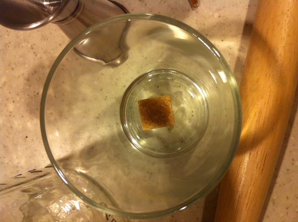 Bitters soaked raw sugar cube ready for an Old Fashioned (photo: Megan Cole)